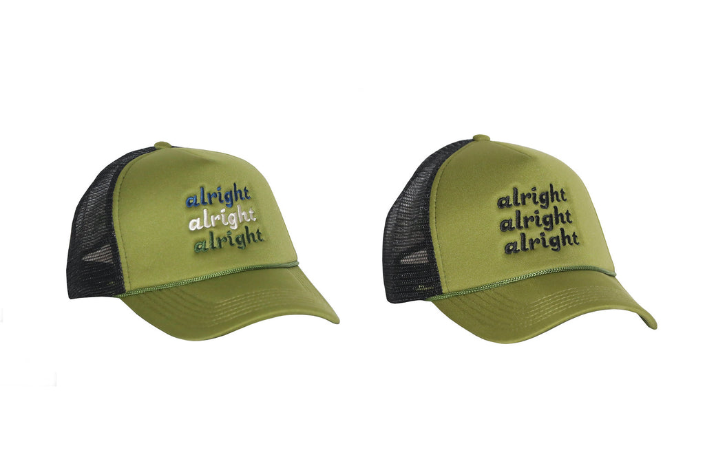 Two foam trucker caps, one with 'alright alright alright' embroidered in black and the other with the same phrase in navy/cream/dark green, on a moss green foam front and black mesh back.