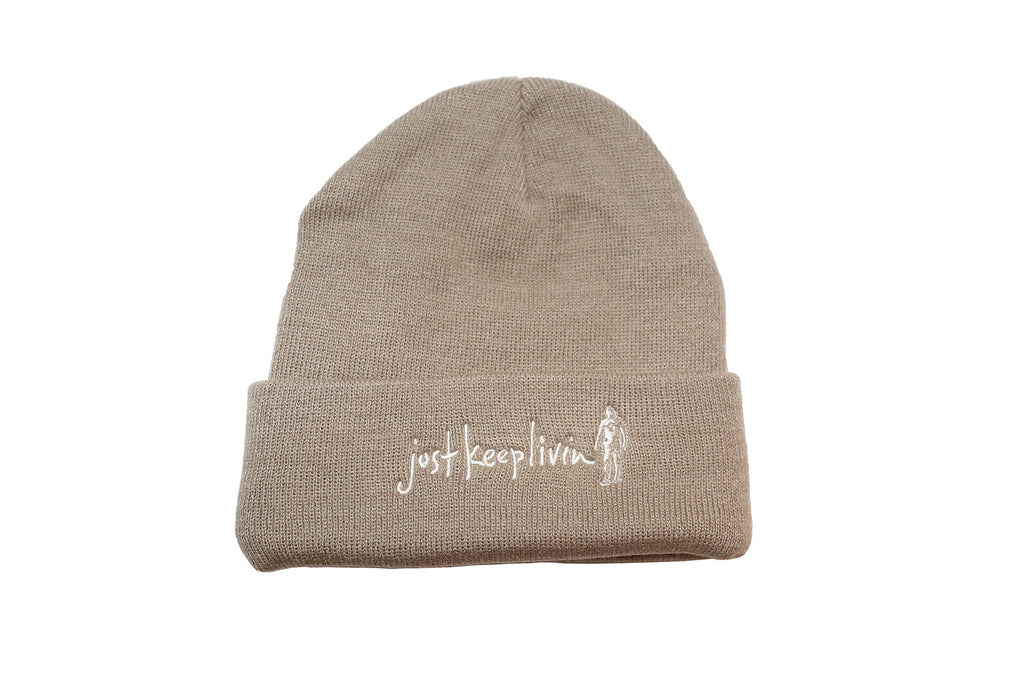 Tan beanie with Just Keep Living embroidered logo in white. 