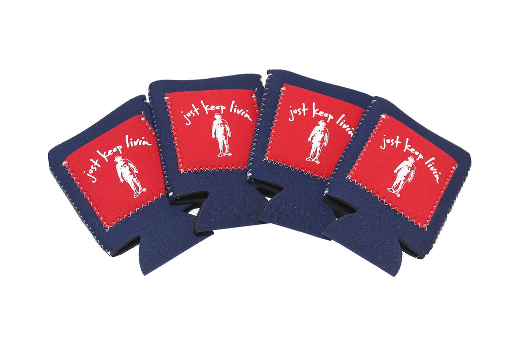 A group of navy blue can coolers with a red pocket with Just Keep livin logo and white text and stitching.