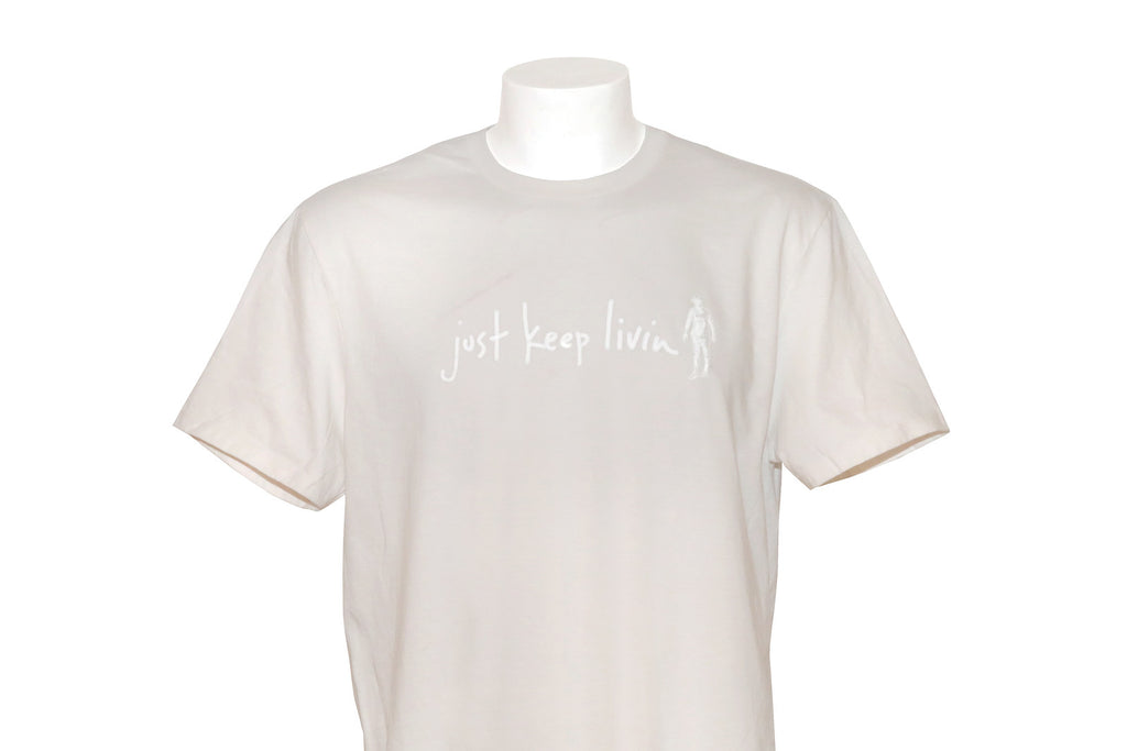 Cream color just keep living short sleeve tshirt with white just keep livin logo. 