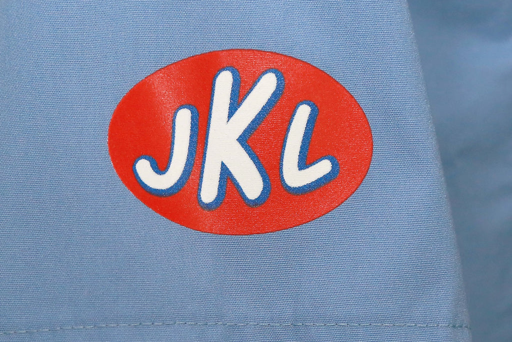 JKL decal Close up of mechanic shirt