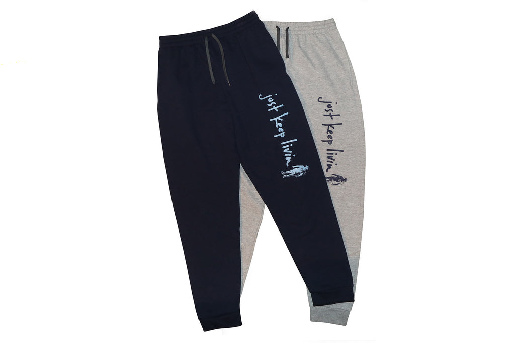 Two sweatpants side by side. One blue and one gray.  Both have just keep livin text logo on left pant leg above knee. 
