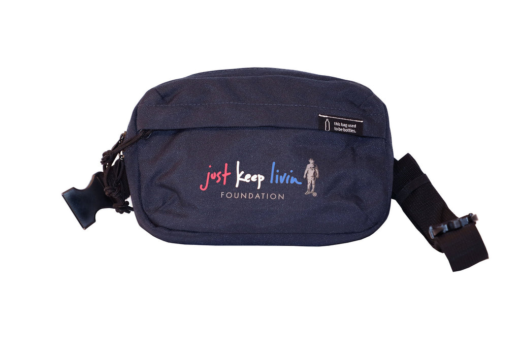 Two belt bags, one in black and one in navy, each with a logo that reads 'just keep livin'.
