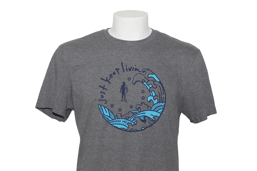 A dark heather gray t-shirt with a round blue screenprinted design on the front, featuring text and wave motifs.
