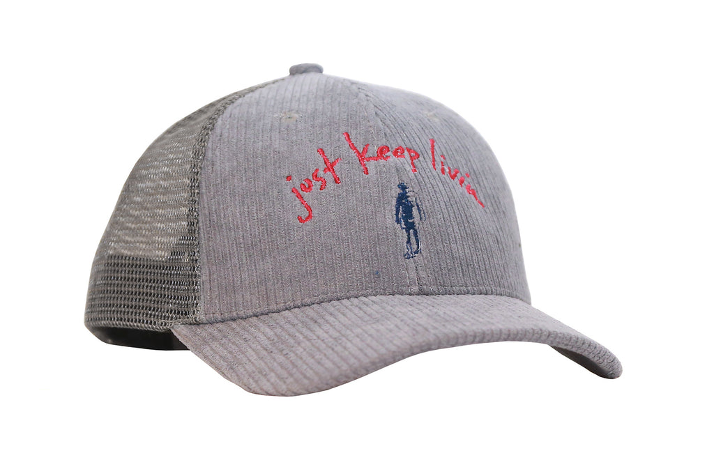 A gray corduroy trucker cap with mesh back panels and snapback closure. It features text and a silhouette just keep living logo embroidery on the front.