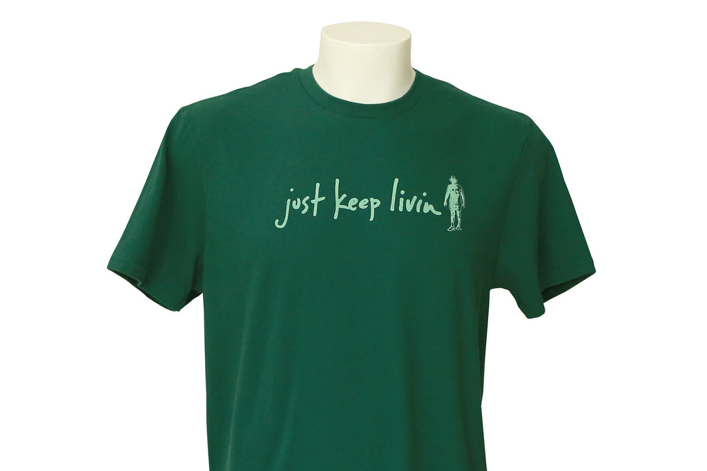 Green t-shirt with light green just keep livin logo. 