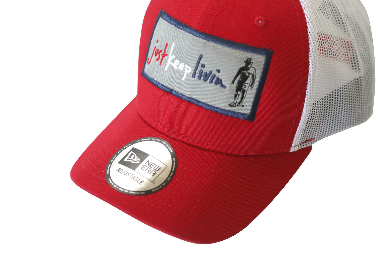A red and white structured cap with a snapback design and an embroidered patch on the front featuring text and a graphic.